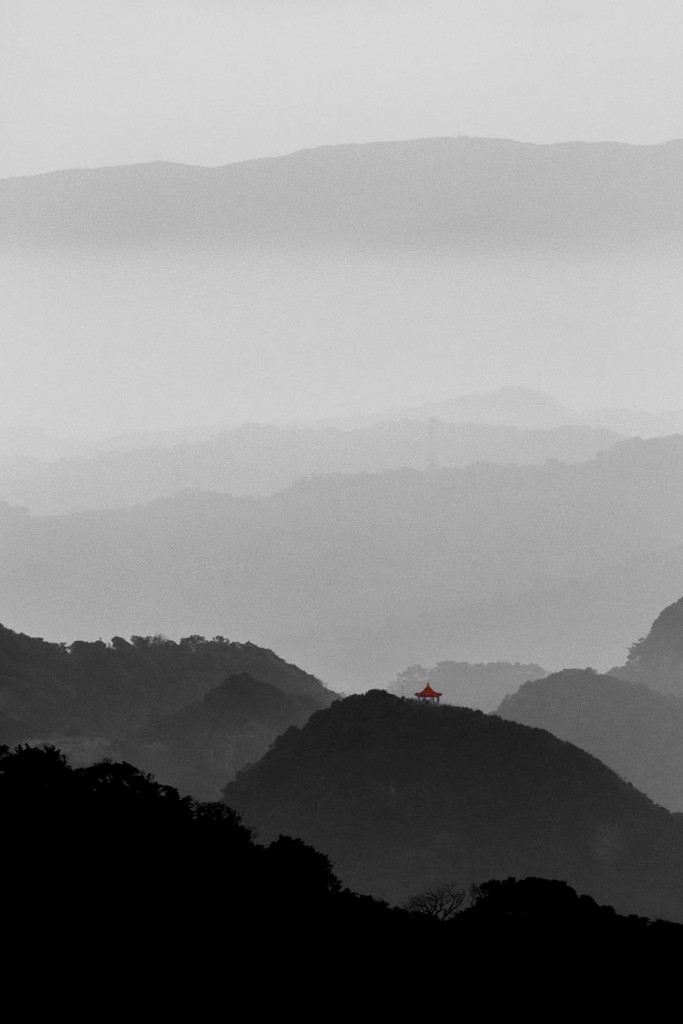 a lone shrine among the misty hills