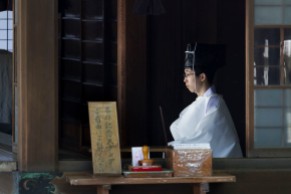 a Shinto priest sitting quietly in meditation
